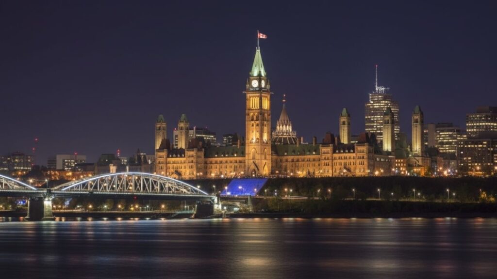 ottawa skyline at night with parliament hill illuminated above the ottawa r 20251118 202615 0000